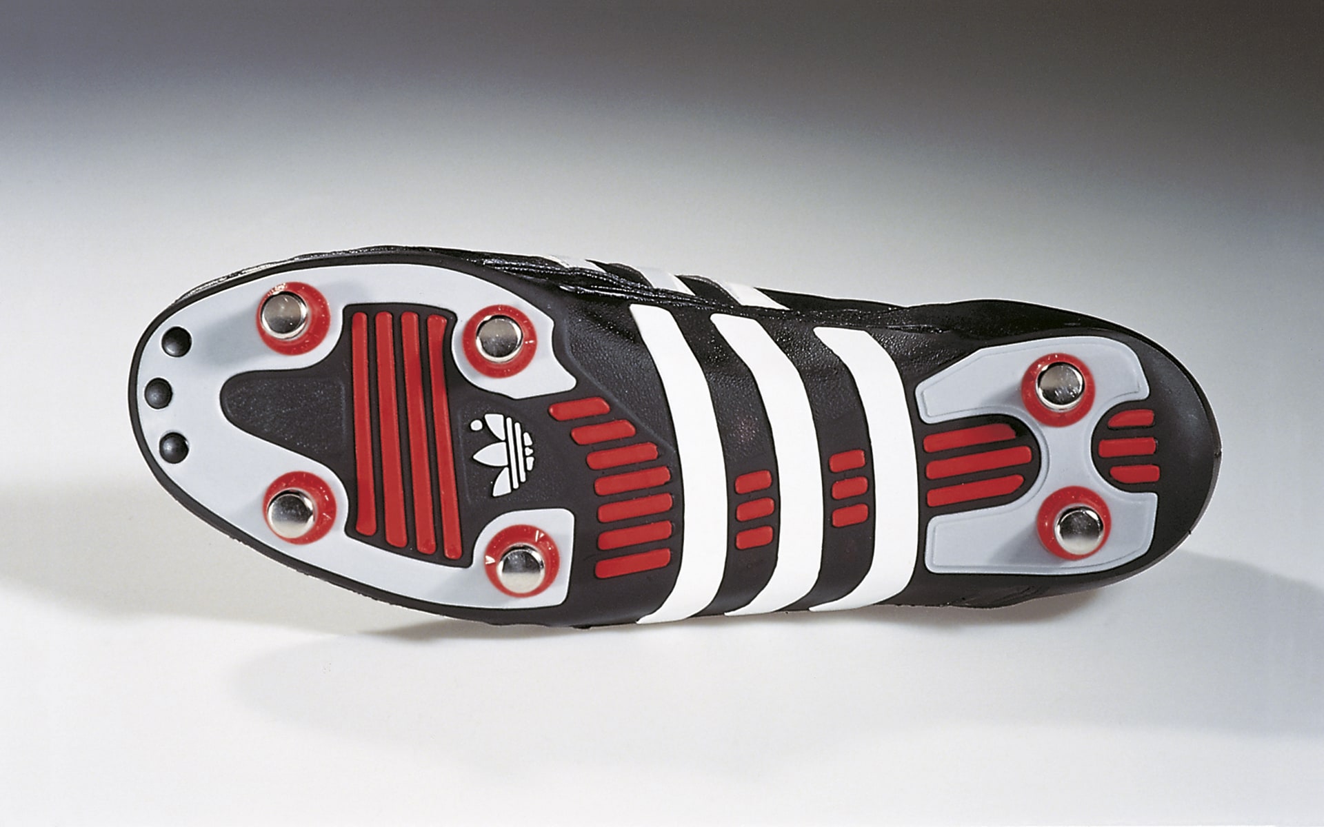 Black-red-and-white World Champion soccer shoe by ITO Design for Adidas, designed in 1990