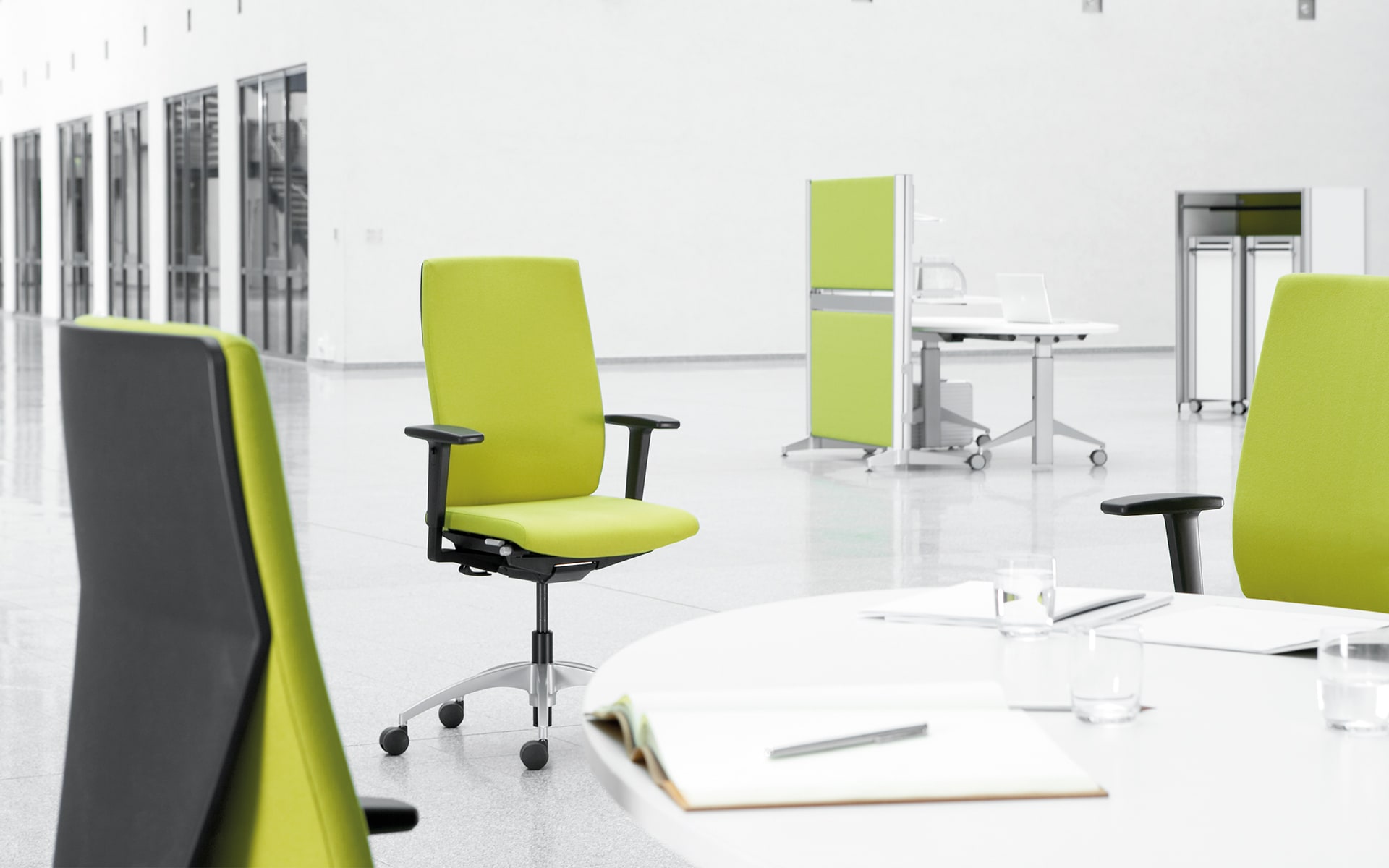 K+N Signeta office chair by ITO Design with bright green upholstery in minimalist workspace