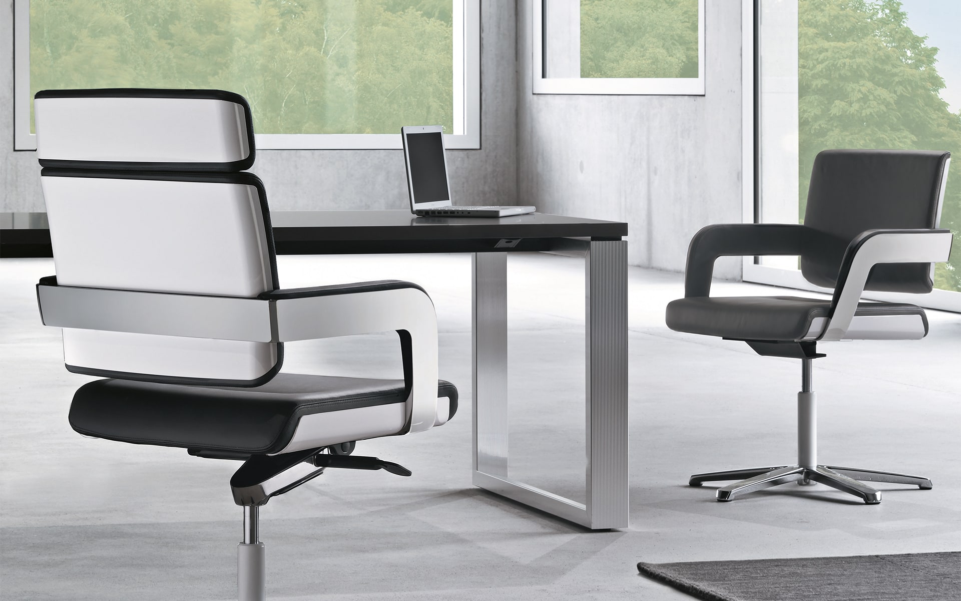 Black-and-white K+N Charta conference chairs by ITO Design in monochromatic workspace