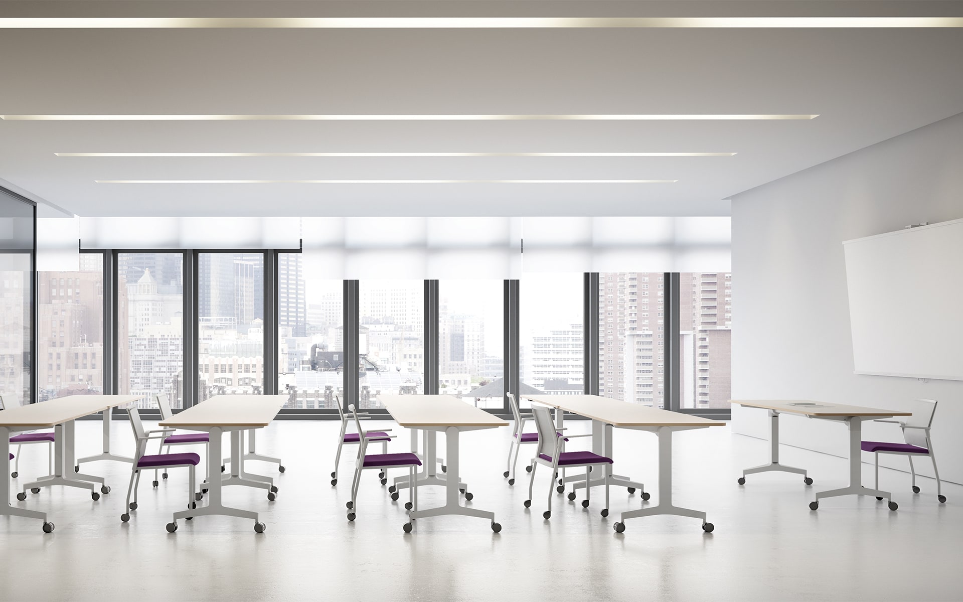 Bright training room that is furnished with Forma 5 Folding Travel folding tables by ITO Design