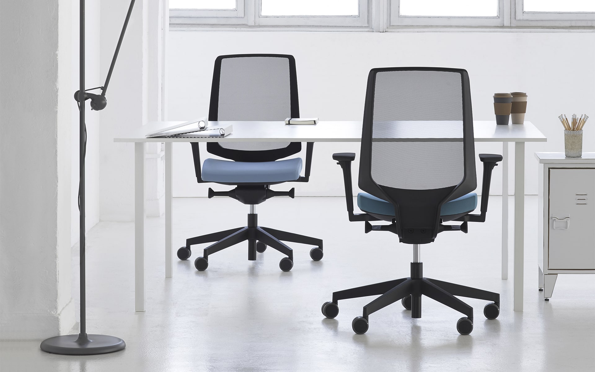 Profim LightUp office chairs by ITO Design with blue upholstery in stylish loft office