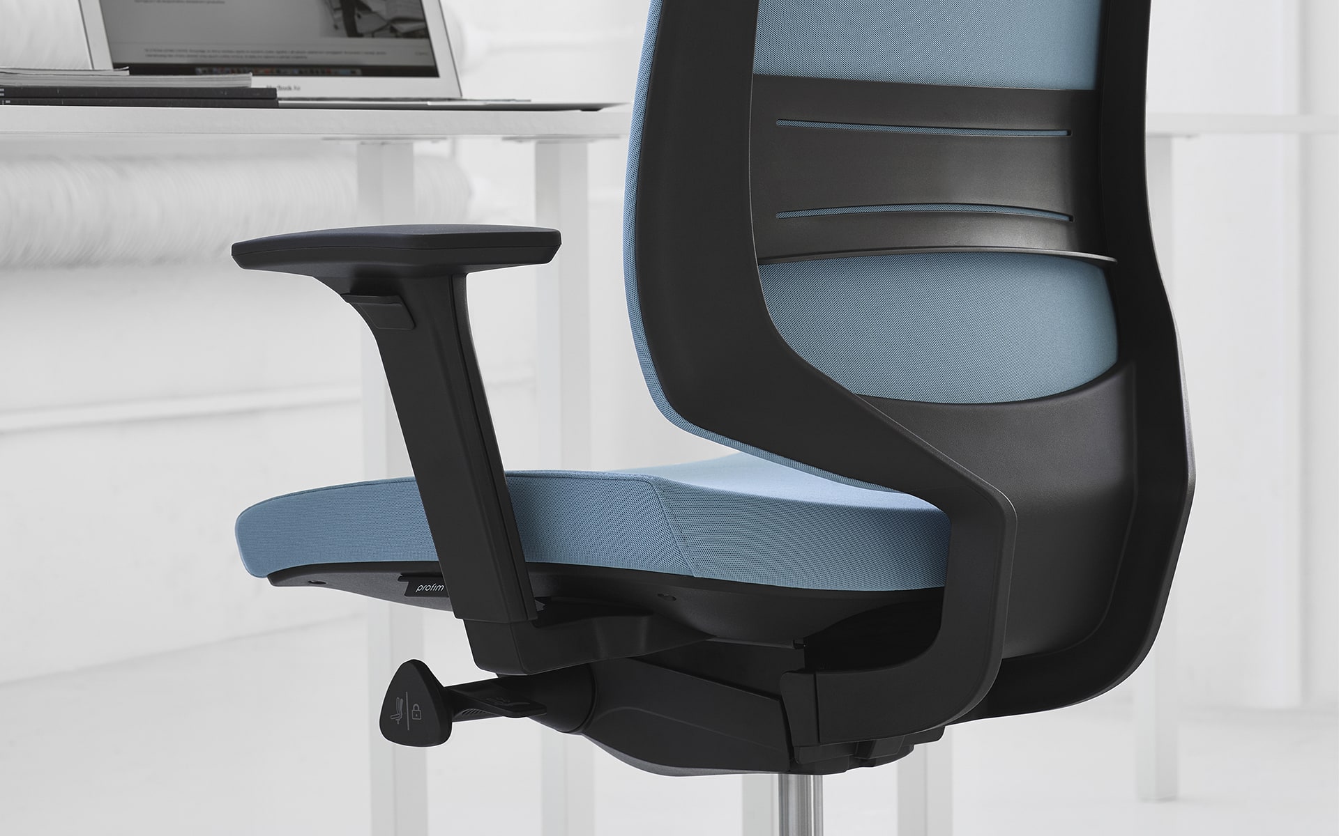 Close-up of the Profim LightUp office chair by ITO Design with blue upholstery