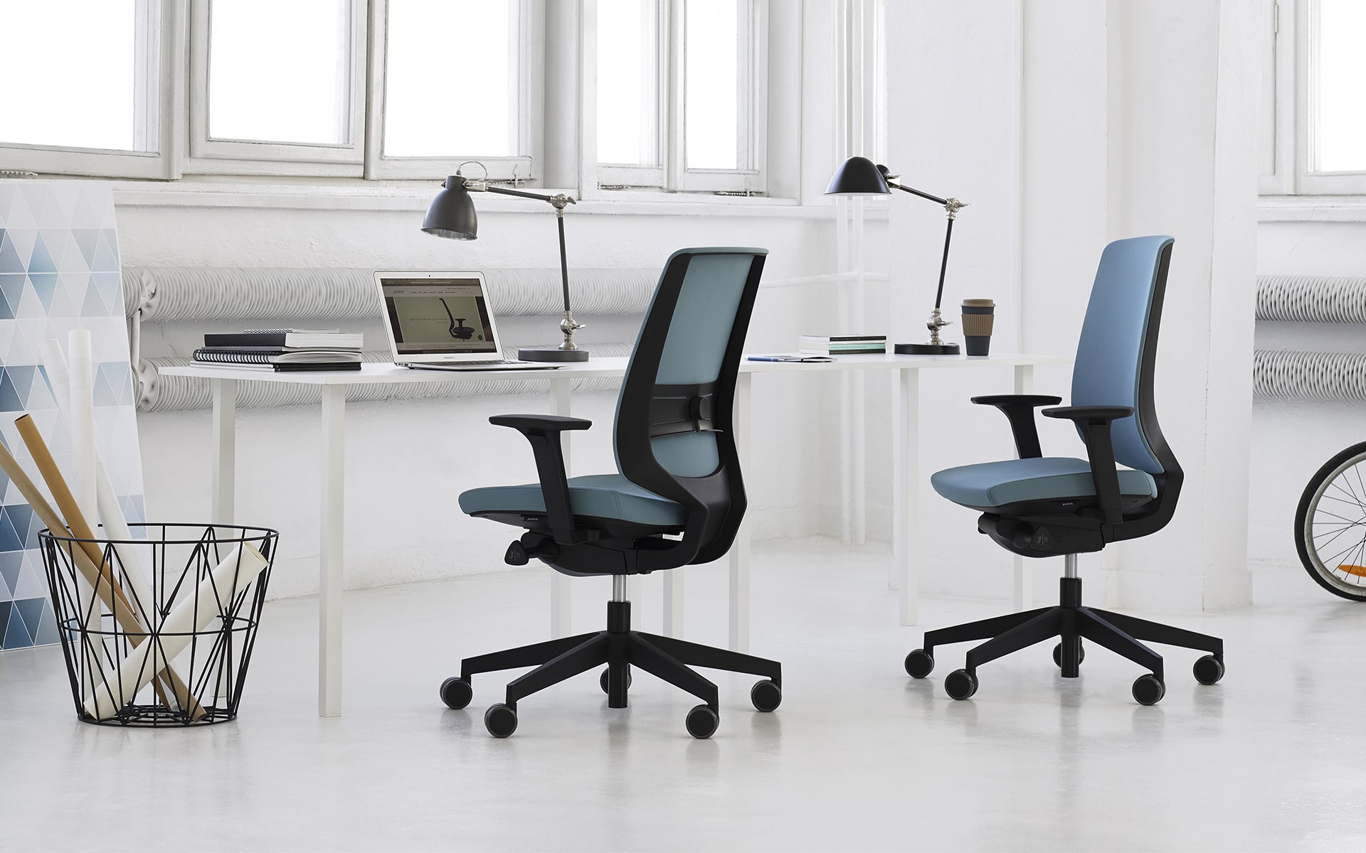 Profim LightUp office chairs by ITO Design with blue upholstery at minimalist desk