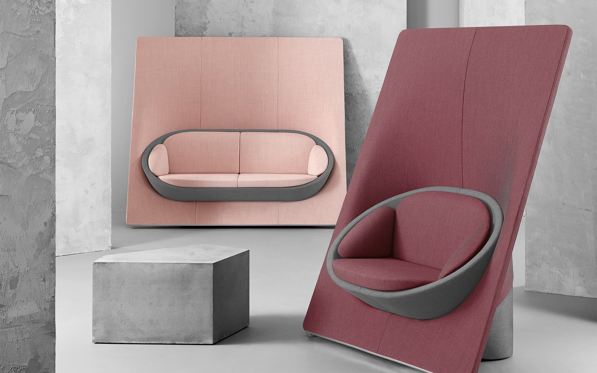 Profim Wyspa lounge seating system by ITO Design in dusky pink and berry beside concrete lounge table