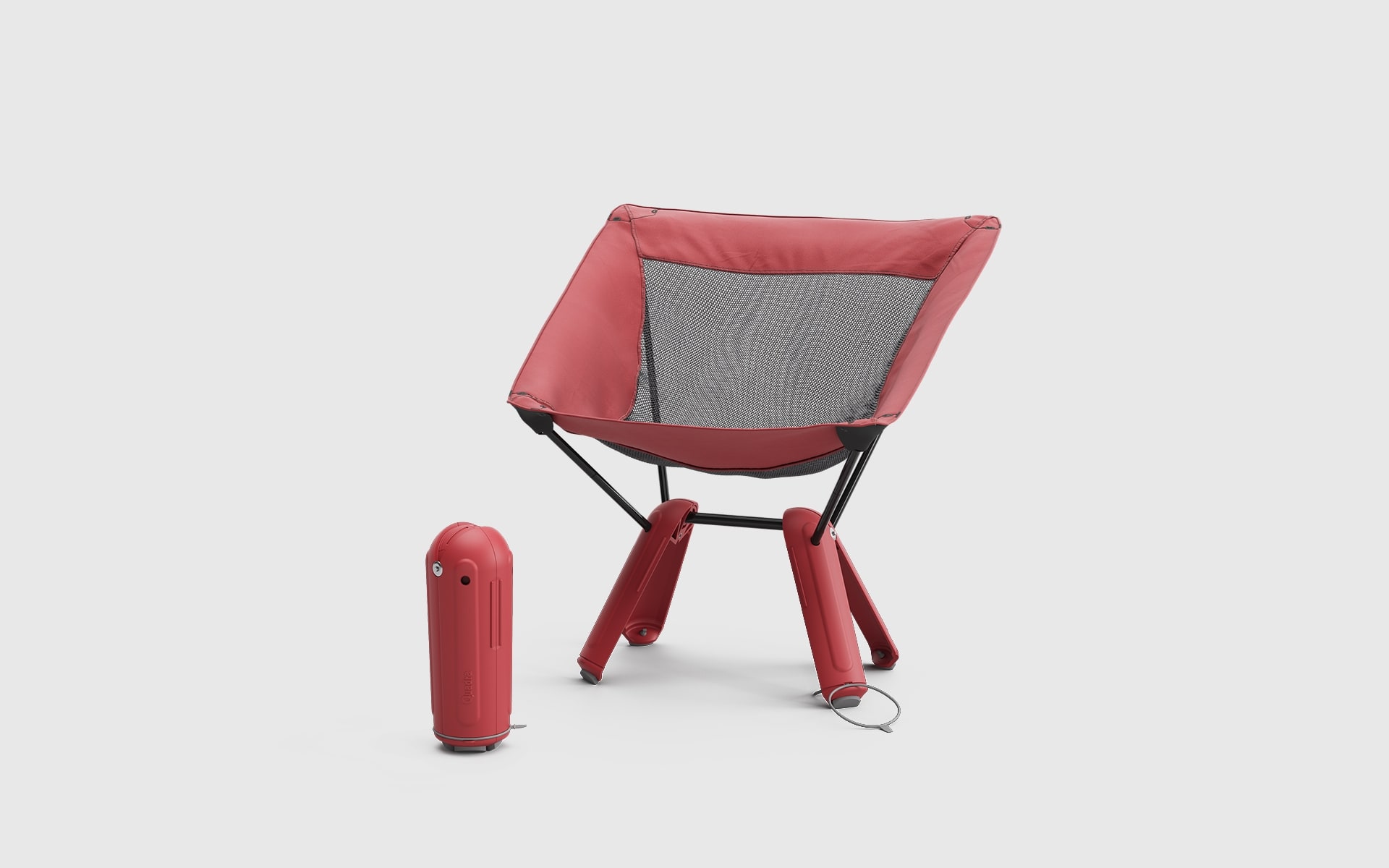 Red Therm-a-Rest Quadra camp chair by ITO Design, next to it a second Quadra camp chair packed into its own base