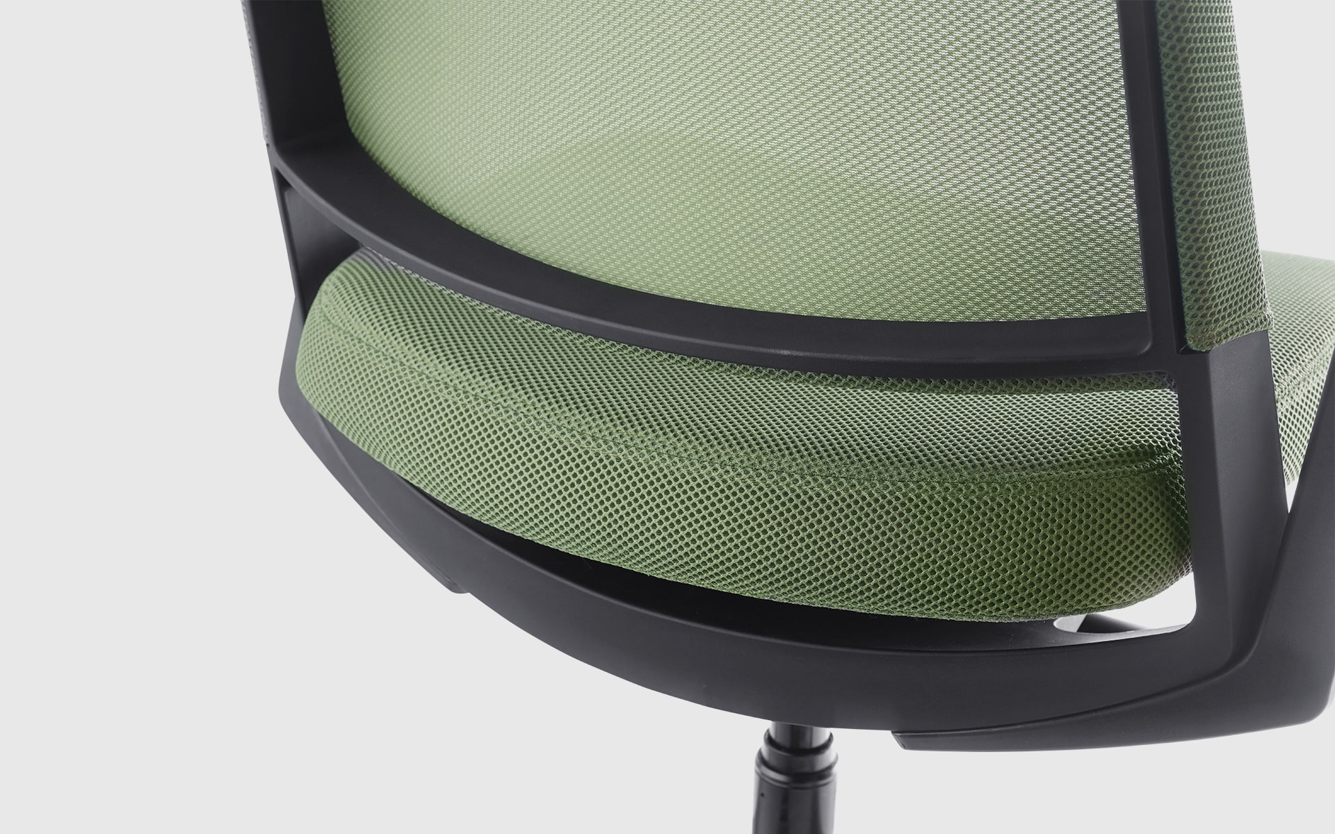 Close-up of the Forma 5 Kineo office chair by ITO Design with pale green mesh upholstery