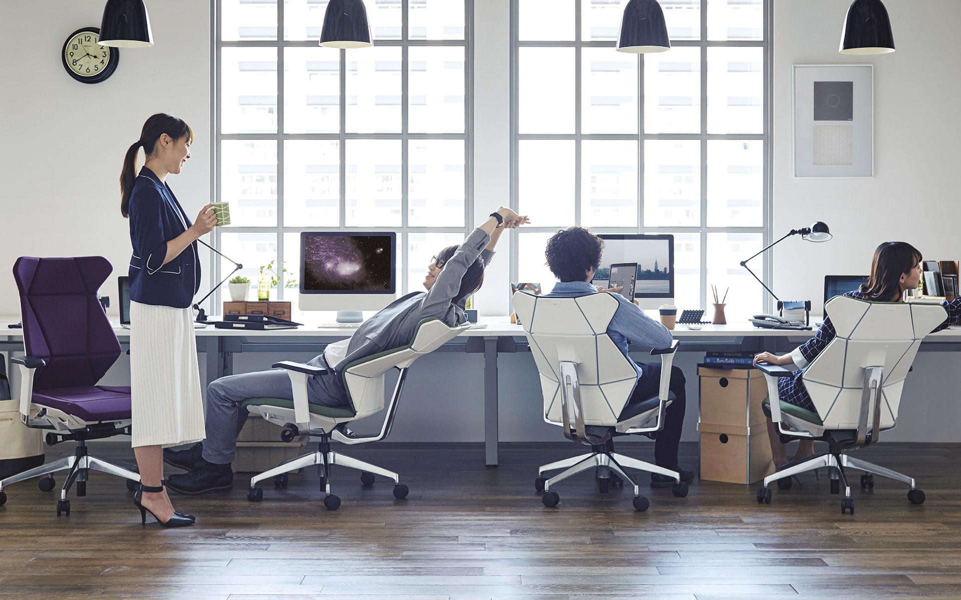 People sit in bright office on ITOKI FF office chairs by ITO Design with origami look