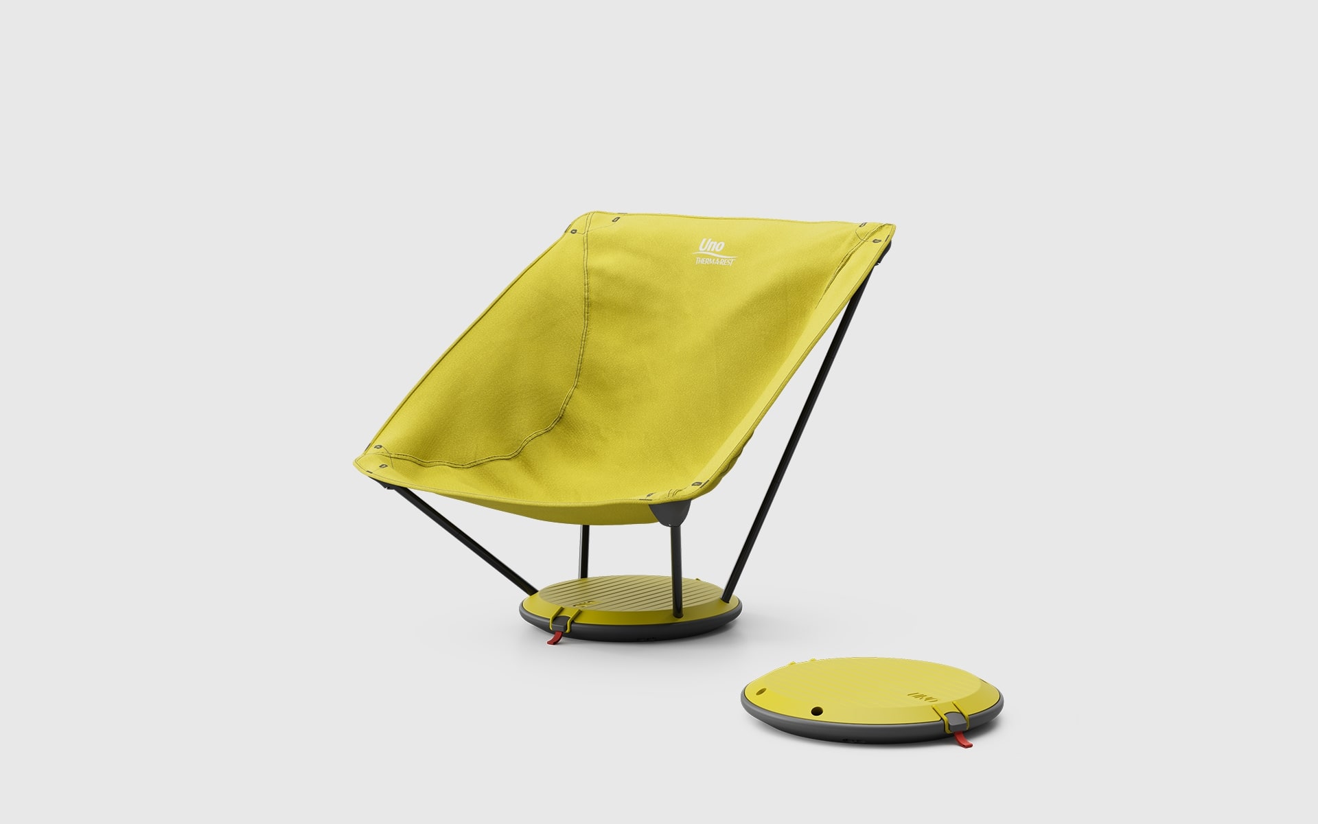 Yellow Therm-a-Rest Uno outdoor chair by ITO Design, next to it a second Uno outdoor chair packed into its own disc shaped base