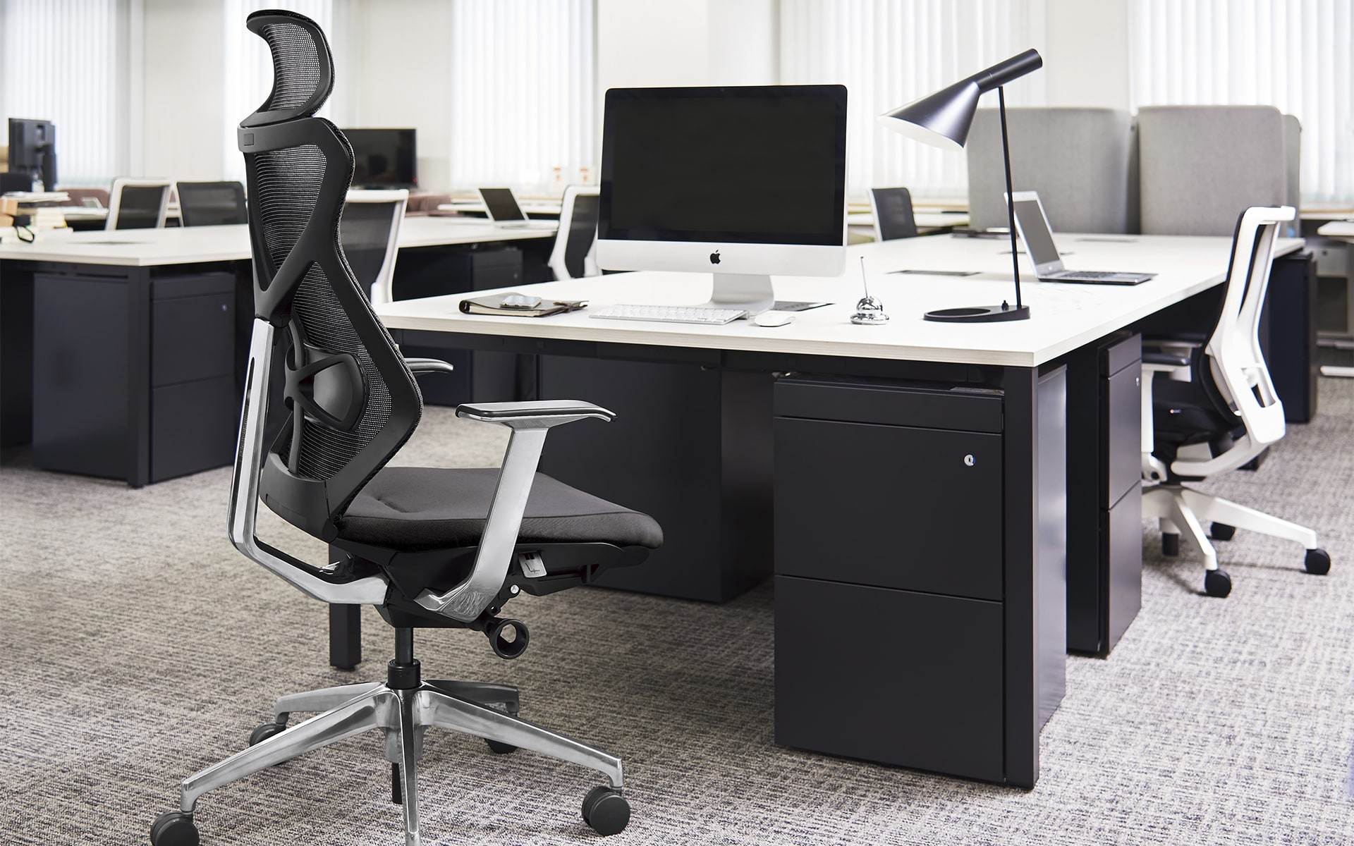 Black-and-grey ITOKI Sequa office chair by ITO Design in black-and-white office