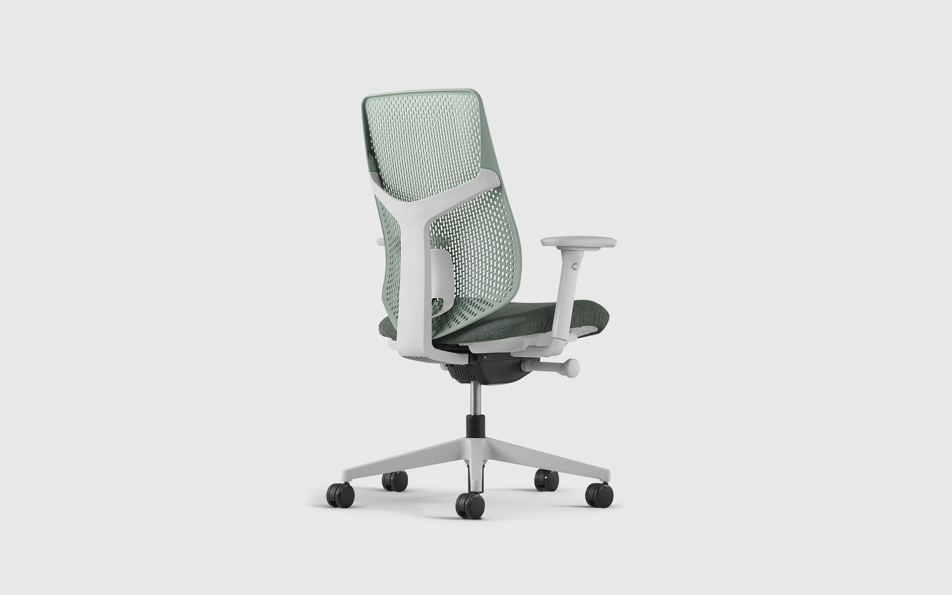 A Hermann Miller Verus office chair by ITO Design with dusty green perforated backrest and seat cushion