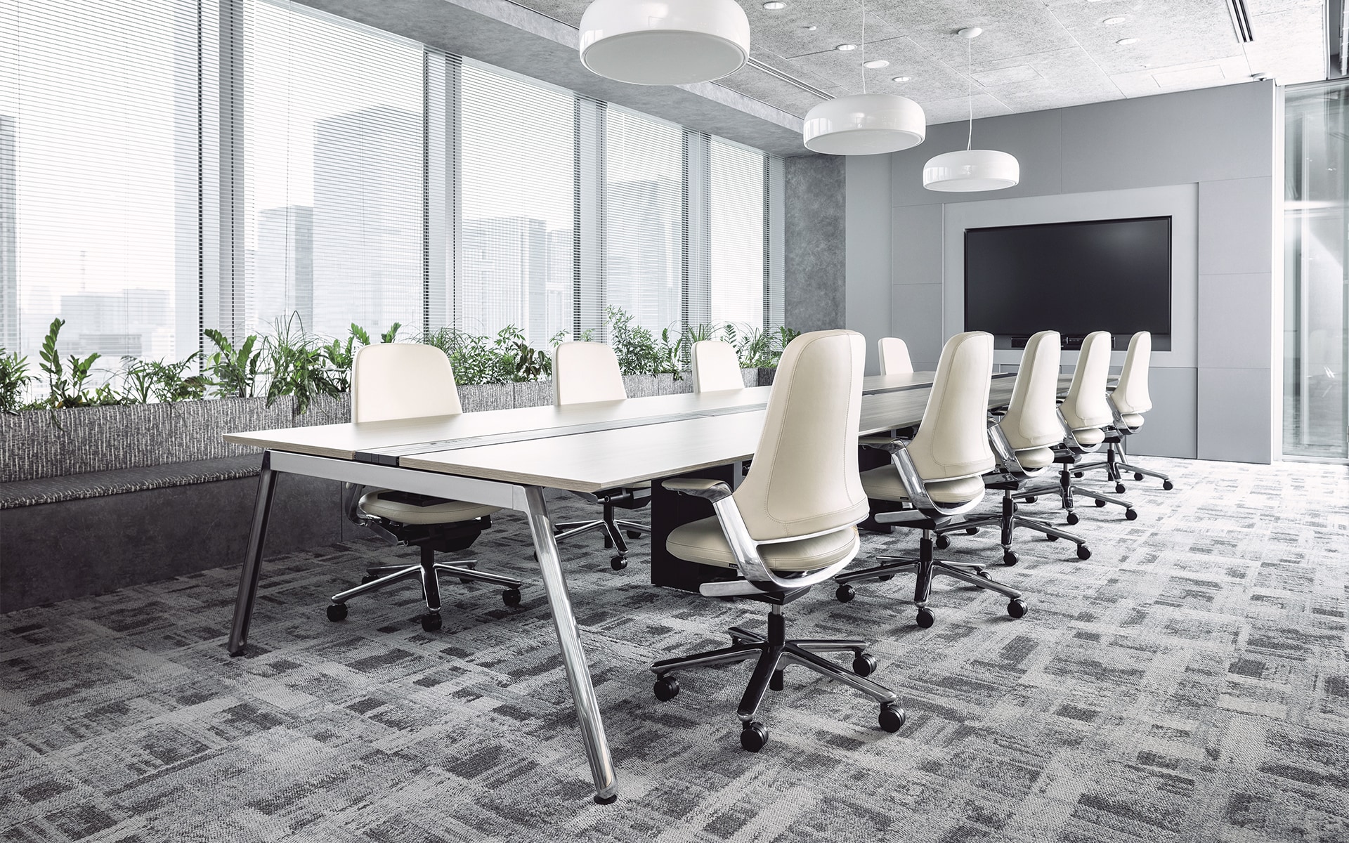 Nine white ITOKI Leonis executive chairs by ITO Design in modern conference room