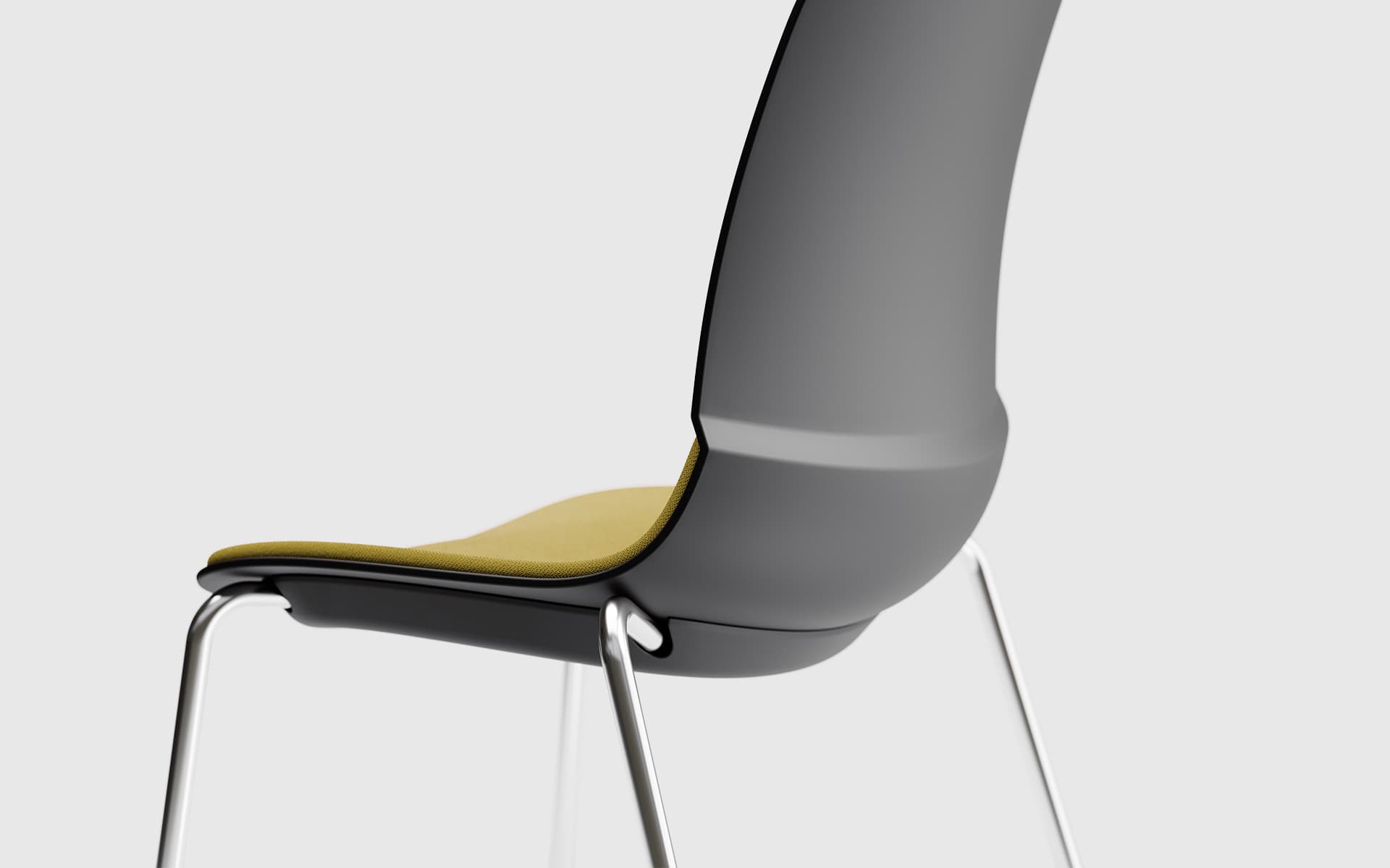 Close-up of a Patra Mika multi-purpose chair by ITO Design in black with ochre-colored upholstery