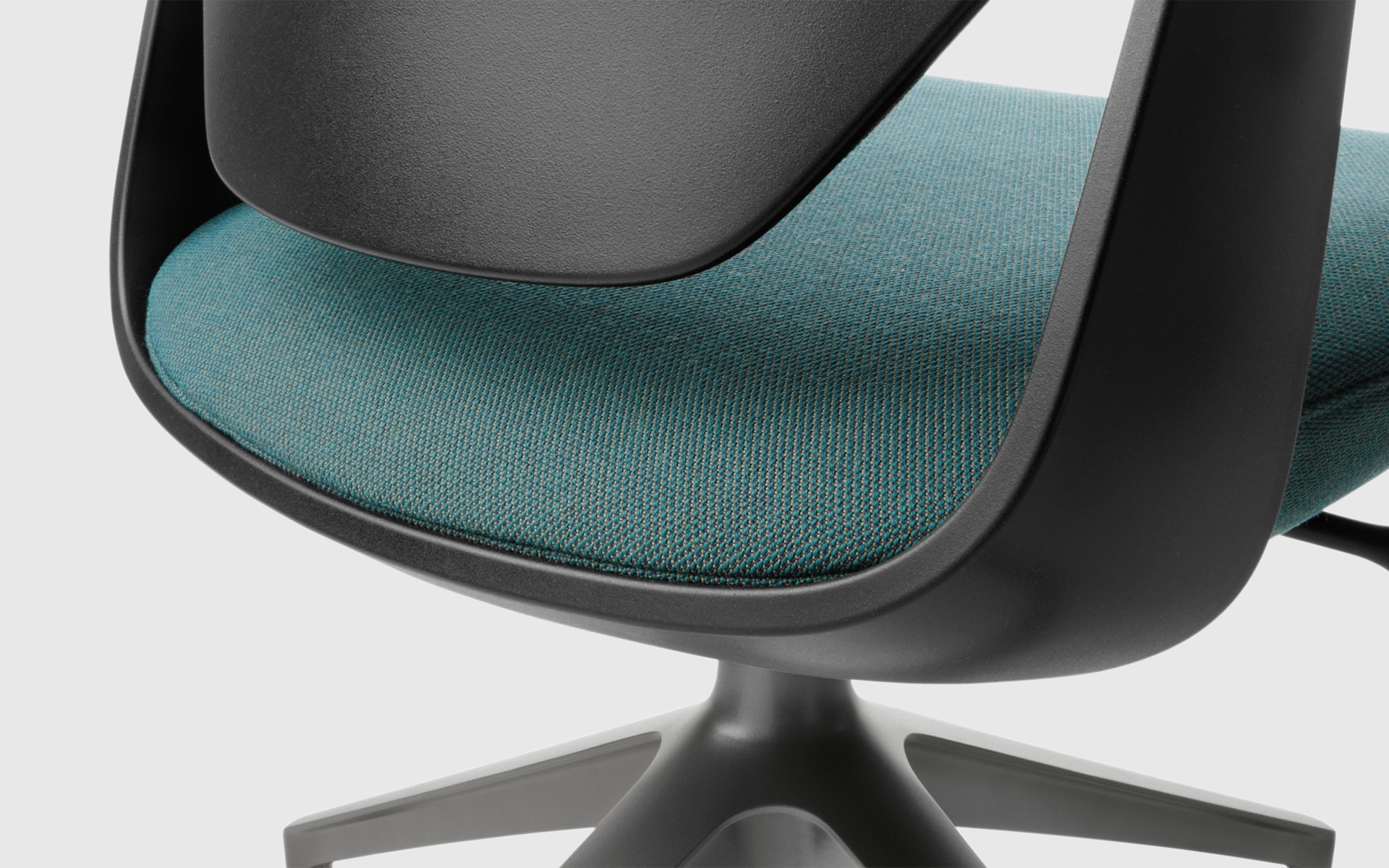 Close-up of a Profim Trillo Pro office chair by ITO Design in black with green upholstery