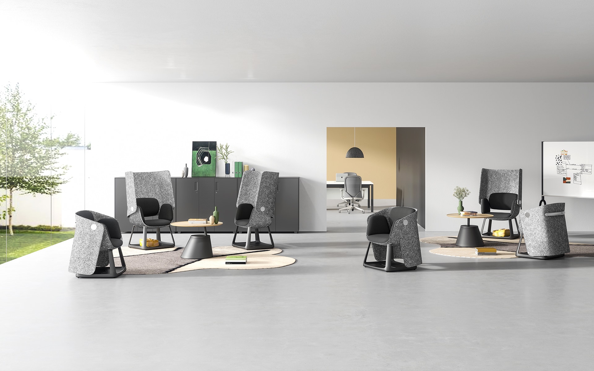 Several grey and black Sunon UF office chairs by ITO Design in a modern co-working space