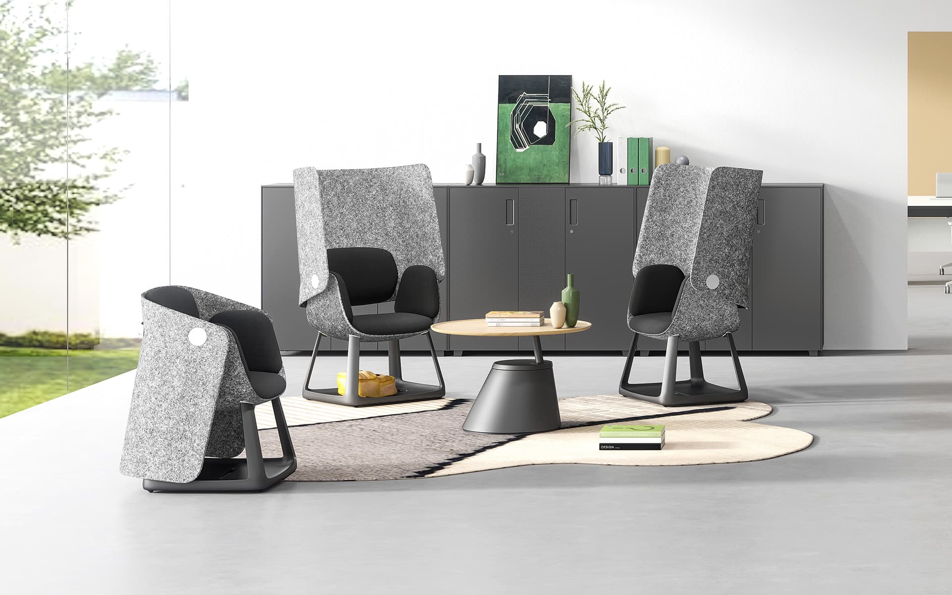 Several grey and black Sunon UF office chairs by ITO Design in a modern co-working space