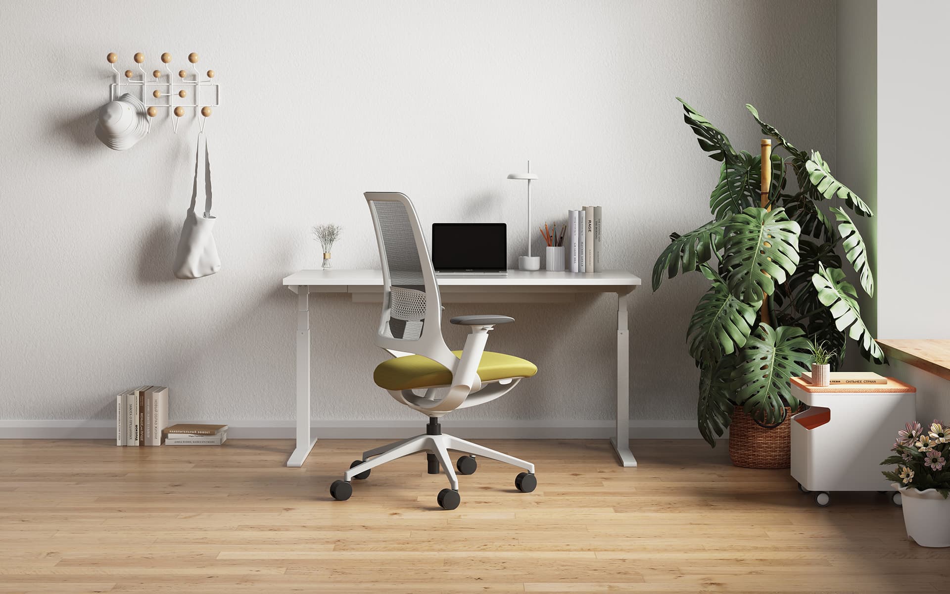 Enova Hug Bürostuhl von ITO Design mit grüner Sitzfläche und grauer Rücken- und Armlehne in einem modernen Homeoffice