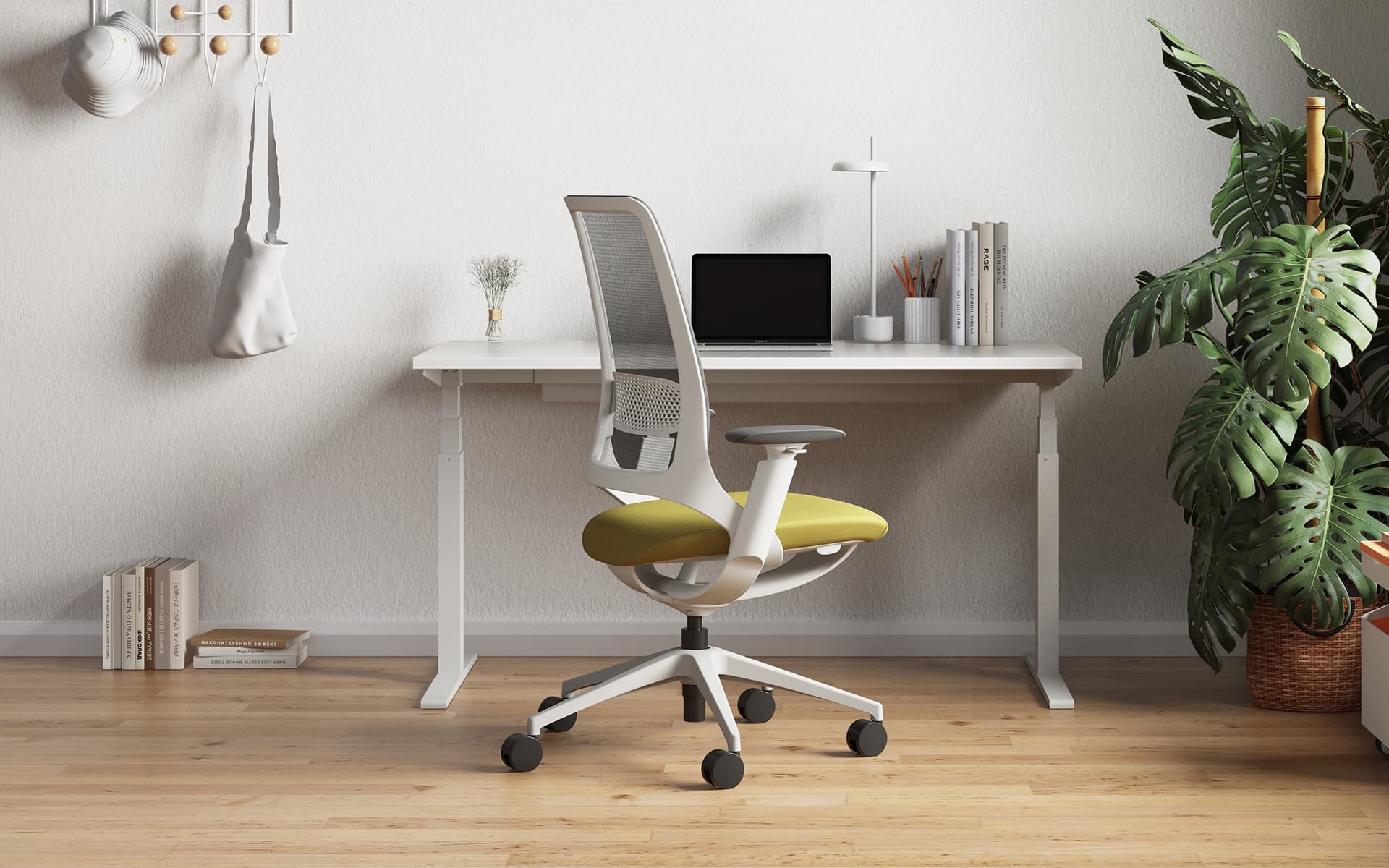Enova Hug Bürostuhl von ITO Design mit grüner Sitzfläche und grauer Rücken- und Armlehne in einem modernen Homeoffice