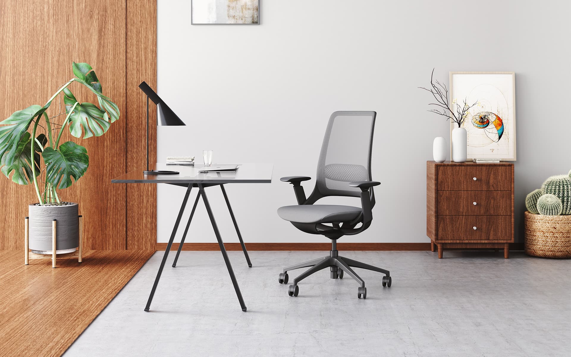 Enova Hug office chair by ITO Design in black with grey upholstery and mesh in a modern, cozy office room